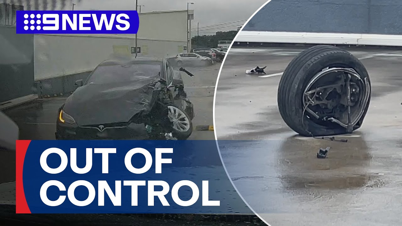 Two people hospitalised after Tesla crashes off ledge | 9 News Australia