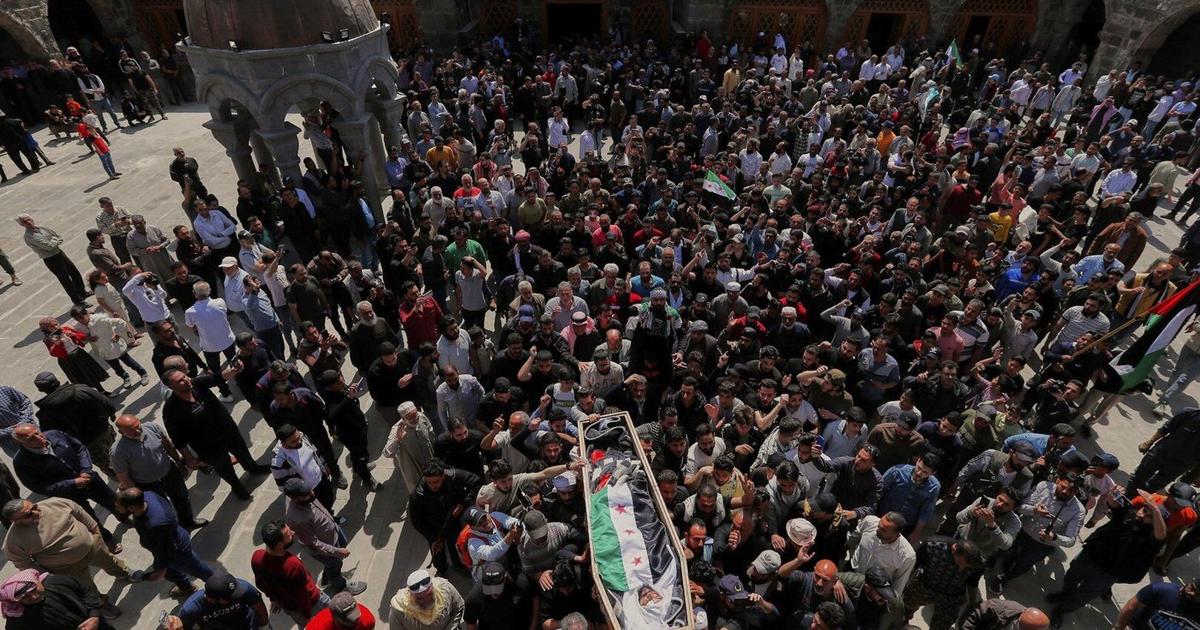 Mourners attend funeral of man killed in Israeli airstrikes on Syrian city of Daraa